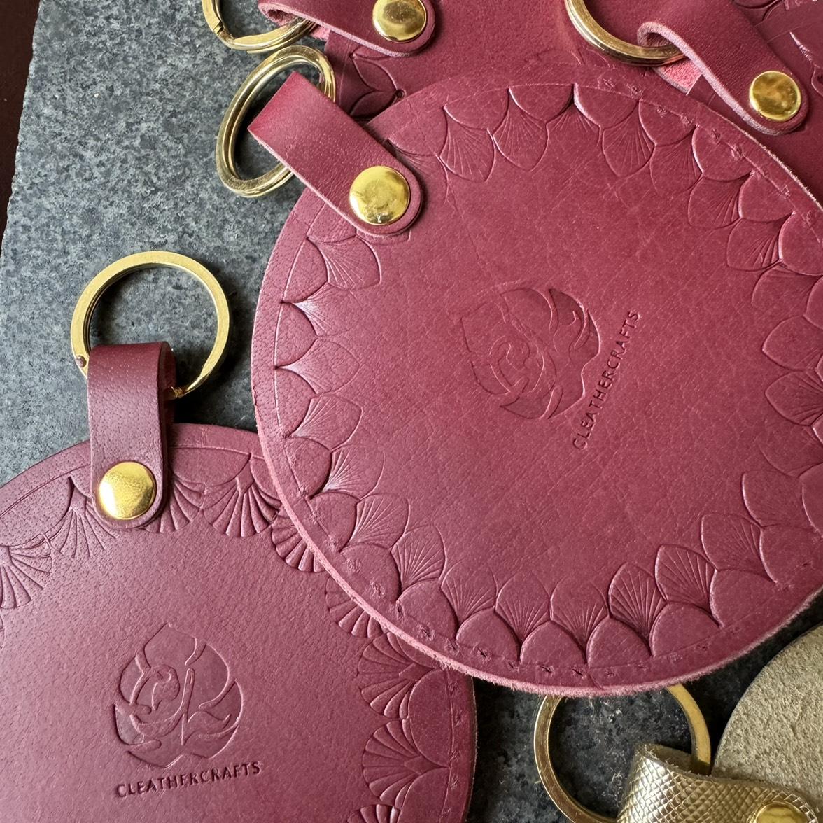 Camera lens cover holders