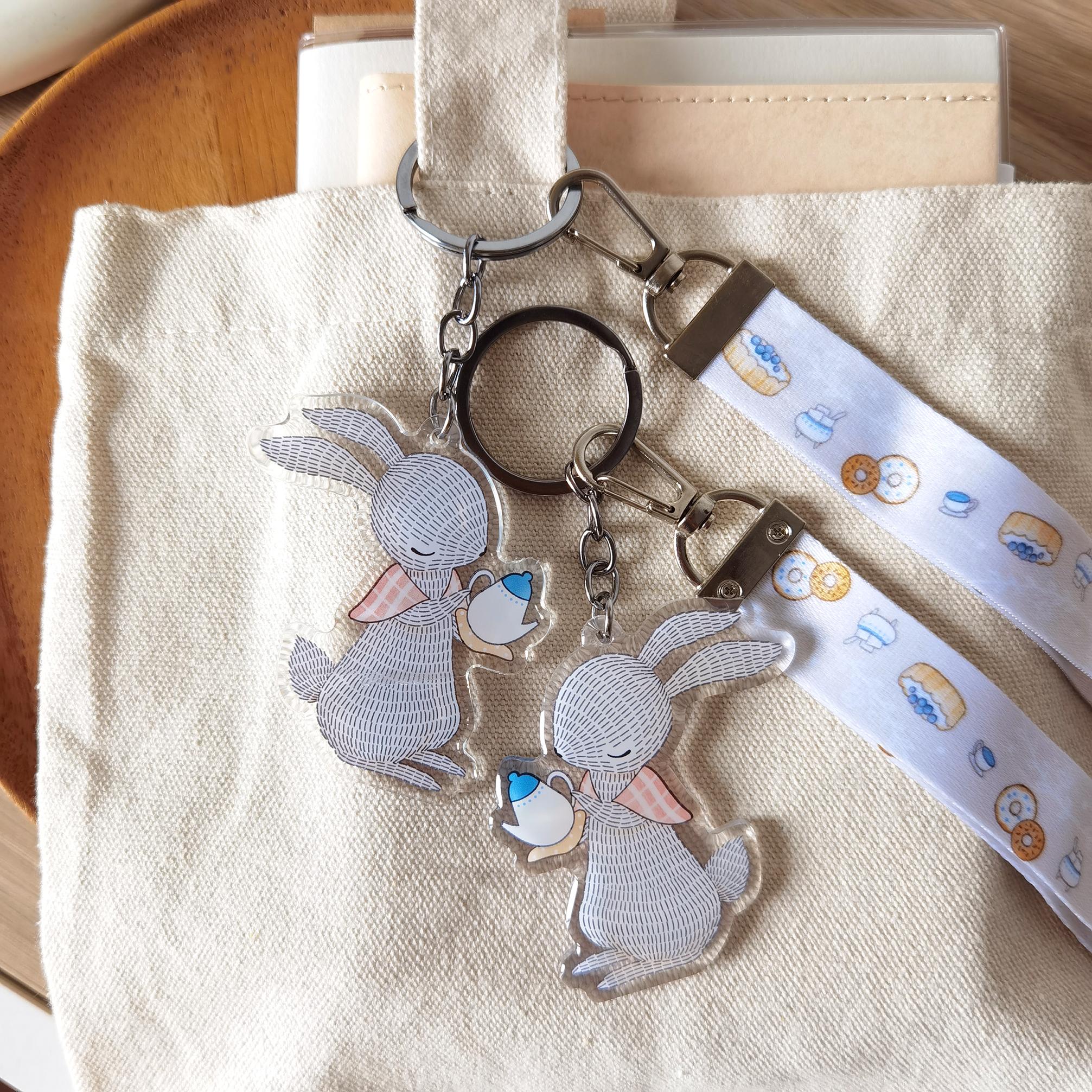 Rabbit Pouring Tea - Wristlet Lanyard & Double Sided on Clear Acrylic Keychain