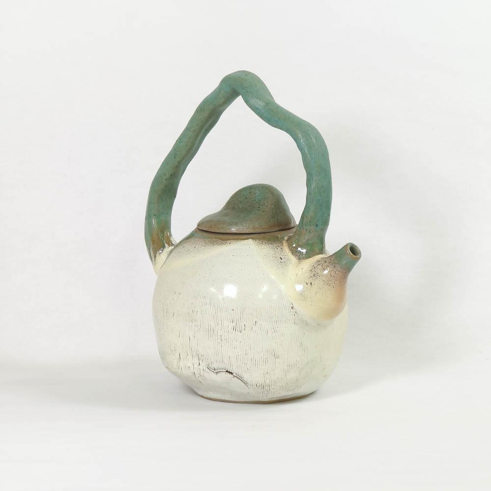 Cracked white teapot