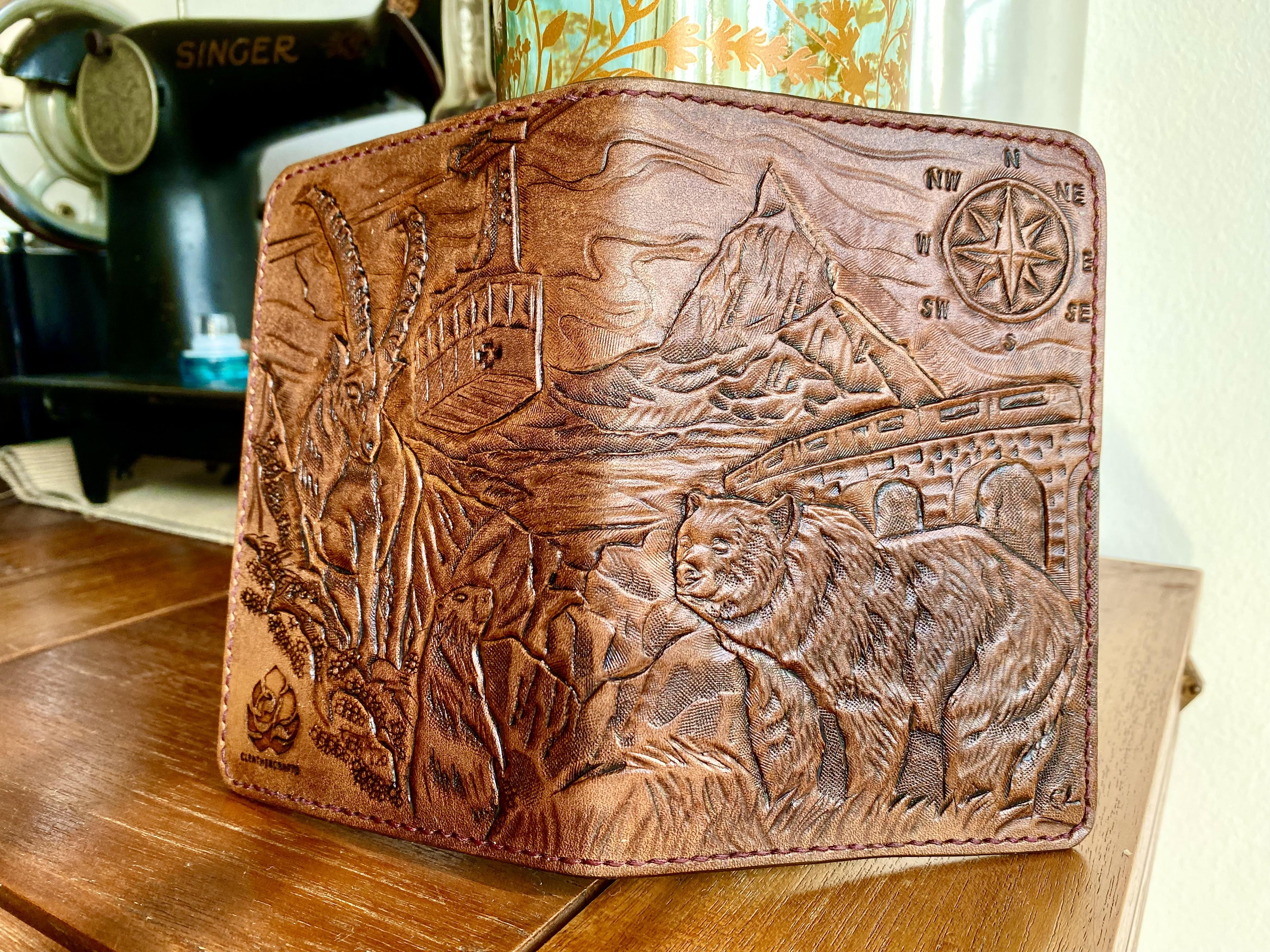 A passport holder tooled to portray the Matterhorn. Made for a client's adventure to Switzerland.