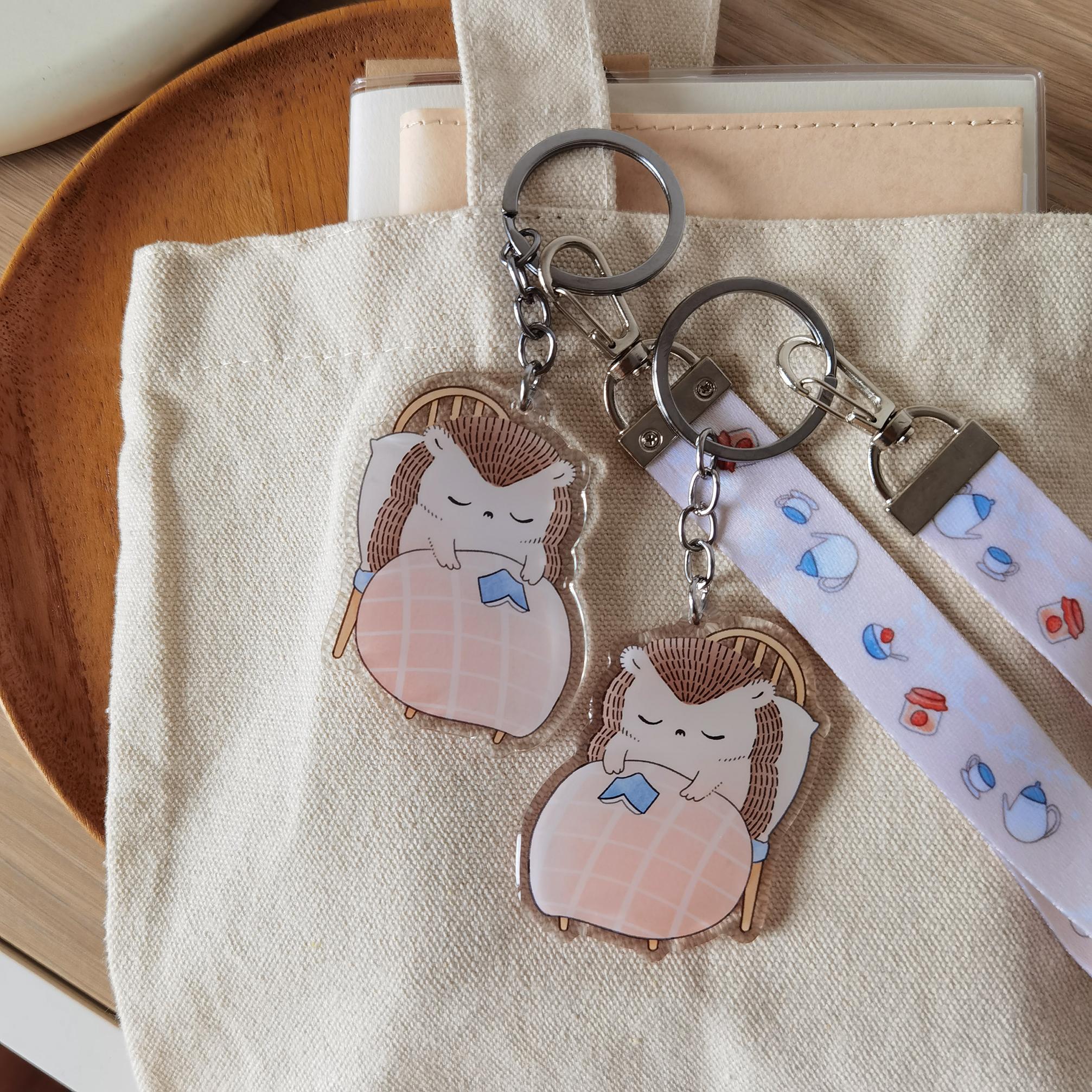 Hedgehog's Cozy Book Nap - Wristlet Lanyard & Double Sided on Clear Acrylic Keychain