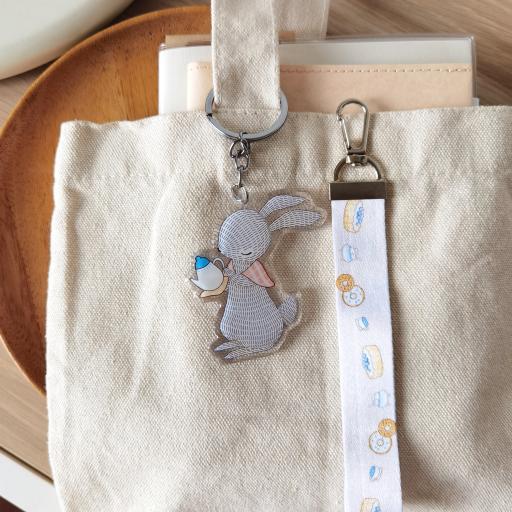 Rabbit Pouring Tea - Wristlet Lanyard & Double Sided on Clear Acrylic Keychain - https://hitpay-production.s3.ap-southeast-1.amazonaws.com/products/9df90c27dbbc4d45adee1dda82ad67a3.jpeg