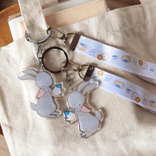 Rabbit Pouring Tea - Wristlet Lanyard & Double Sided on Clear Acrylic Keychain - https://hitpay-production.s3.ap-southeast-1.amazonaws.com/products/9df90c291261467cb89d3ceb7fb7fcf2.jpeg